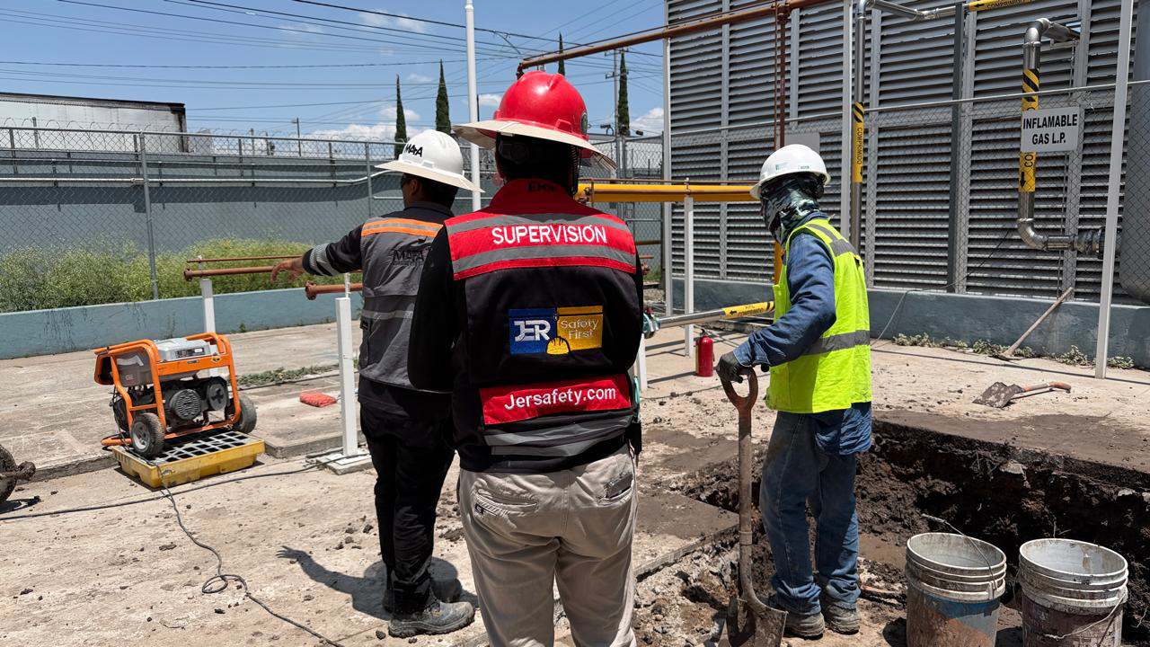 Safety engineer inspecting machinery