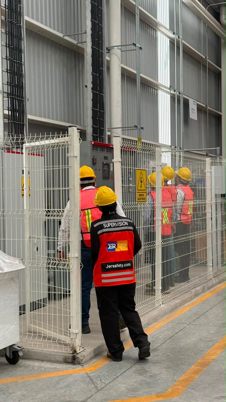 Safety engineer inspecting machinery